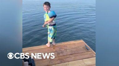 Boy finds the courage to jump off dock into Alaska lake
