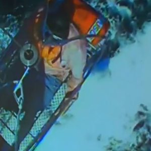 3 men rescued from shark-infested waters