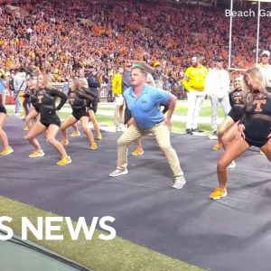 Fake "security guard" joins in on dance team's routine