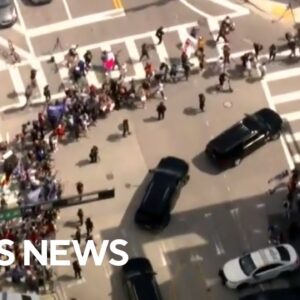 Trump motorcade leaves courthouse after arraignment in Miami with supporters alongside