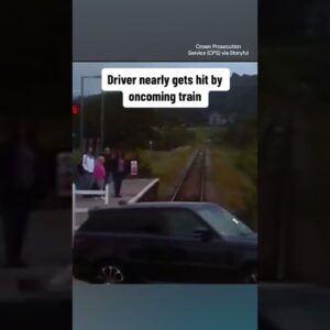 Car nearly hit by oncoming train #shorts