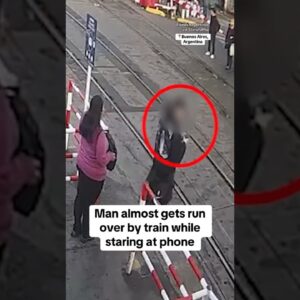 Man almost gets run over by train while staring at phone #shorts