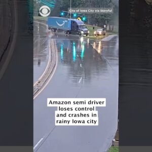 Traffic camera video shows driver of Amazon semi-truck lose control and crash in Iowa #shorts
