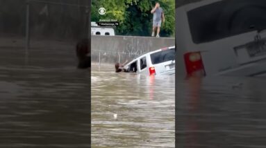 Tennessee utility worker swims through floodwaters to save woman from trapped car #shorts