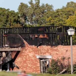 Shooter rammed truck into church, opened fire and set massive blaze, officials say