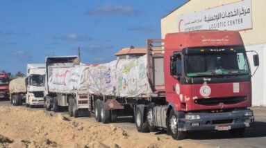 Aid trucks prepare to enter Gaza as Israel says ceasefire is in effect