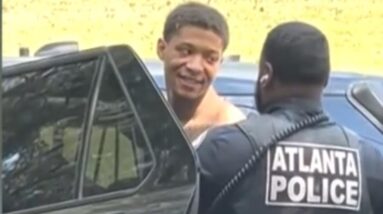 Escaped inmate blew a kiss and smiled as he was detained for fleeing prison